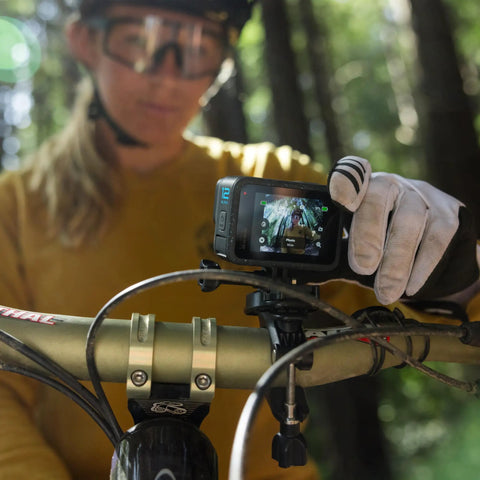Premium Waterproof Action Camera Bundle With 5.3K60 Video And 27Mp Photos mounted on a bike handlebar for extreme sports.