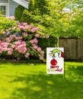 Decorative garden flag from 89Pcs Sublimation Blanks Kit For DIY Heat Press Projects in a garden setting with flowers and greenery.