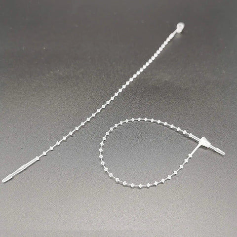 One Thousand Pack Of 5 Inch Adjustable Security Beaded Loop Ties With Snap Lock Pins Ideal For Retail Price Tags And Shipping Seals With Rock Solid Tamper Protection And Straight Up Effortless Hook Up Anywhere, clear plastic ties.