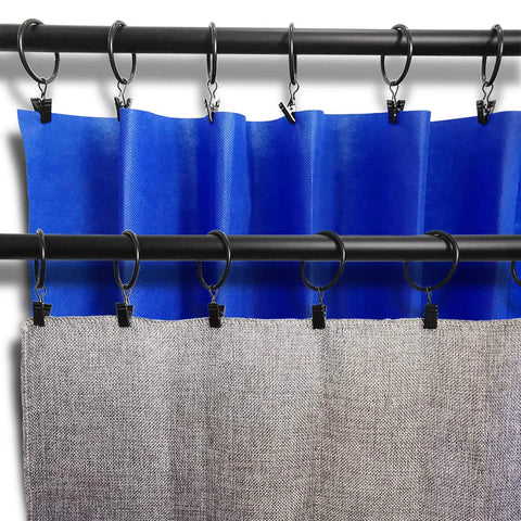 Sturdy 20 Pack Metal Curtain Ring Clips Set For Drapes 1.5 Inch Inner Diameter Black No Slip Clip Rings For Secure Hang On Curtain Rods Easy Clip On Design Great Value shown holding blue and grey curtains on a rod