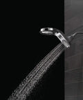 HydroRain Two In One Shower Head Chrome Finish With Rain Can And Handheld Combo with water flow against dark background