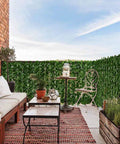 Artificial Ivy Privacy Fence Screen 118 By 39.4 Inches For Outdoor Walls And Garden Decor around a cozy patio area.