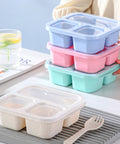 Stack of Kids Bento Box Set 4 Pack With 3 Compartments For Meal Prep, pastel-colored wheat straw with lids, on table.