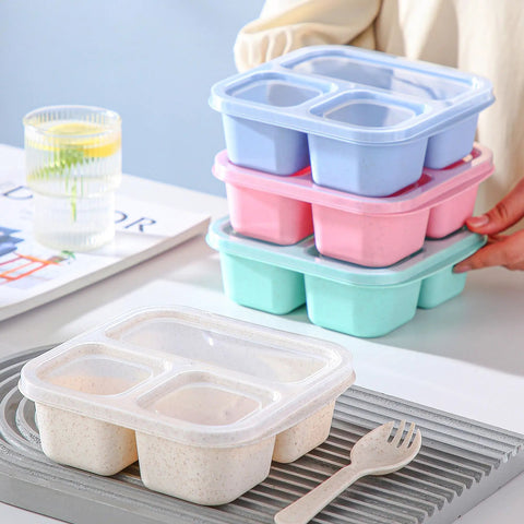 Stack of Kids Bento Box Set 4 Pack With 3 Compartments For Meal Prep, pastel-colored wheat straw with lids, on table.