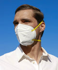 Person wearing N95 Foldable Mask Pack USA Made NIOSH Approved 20 Count With Anti Counterfeit Packaging Particulate Respirator STS F100