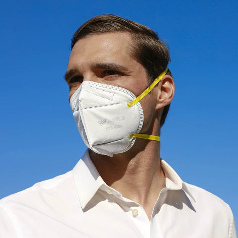 Person wearing N95 Foldable Mask Pack USA Made NIOSH Approved 20 Count With Anti Counterfeit Packaging Particulate Respirator STS F100