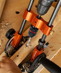 Portable Multi Angle Drill Guide With 60 Degree Adjustable Stand in use on wooden workbench for precise hole alignment.