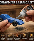 Hand applying 4 Oz Graphite Powder Lubricant For Locks And Hinges, 3000 Mesh High Pure Graphite, on a wooden toy car axle