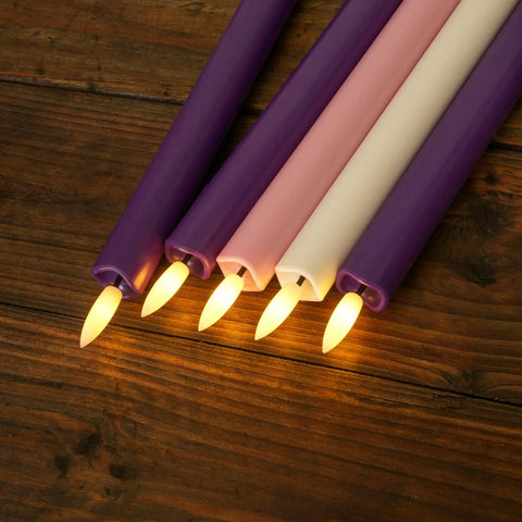 Flickering Flameless Taper Candles With Remote, 10 Inch LED Candlesticks in purple, pink, and ivory on wood surface