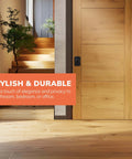 Stylish matte black privacy door knob installed on wooden door for bathroom, bedroom or office, enhancing decor and functionality.