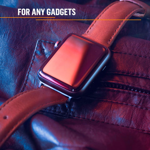 Smartwatch with brown leather strap, front view on dark textured leather surface.