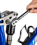 Cyclist using Gear Up Bike Torque Wrench Set 1/4 Inch Drive With Hex And Torx Bits 2-20 Nm Click Wrench on bike frame.