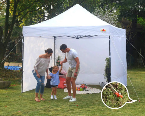 Family enjoying outdoor gathering with gazebo secured by 11 Inch Tent Stakes 10 Pack Heavy Duty Ground Anchors for Outdoor Camping and Gazebo Setup.