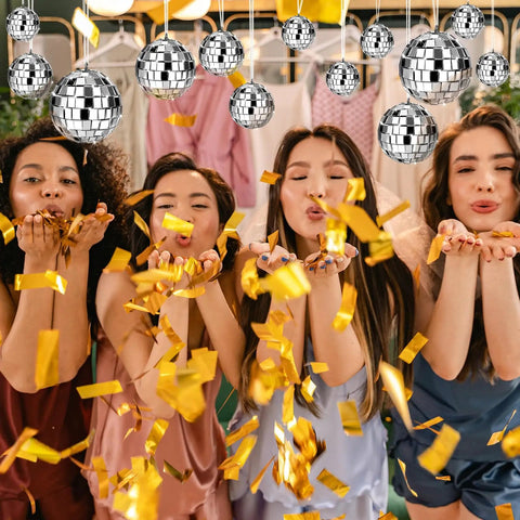 24 Pcs Mirror Disco Balls Hanging Set In Four Sizes 2.4 Inch, 2.0 Inch, 1.6 Inch, 1.2 Inch, Silver Glass Ball Ornaments For Disco Party Decor displayed with confetti.