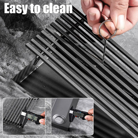 Heavy Duty Linear Shower Drain With Sleek Rectangular Grate For Effortless Center Drainage And Clog Free Removable Pan with cleaning tool.