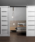 Nordic white Quadro 4088 Barn Door Set with frosted glass, 84x96 inch dual sliding doors, solid MDF core, installed in a bedroom.