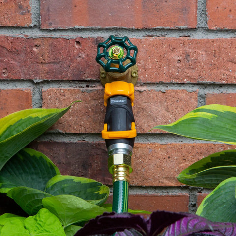 Lever Flow-Through Valve Connector Bundle For Hose Fittings with high volume water flow installed on outdoor tap.