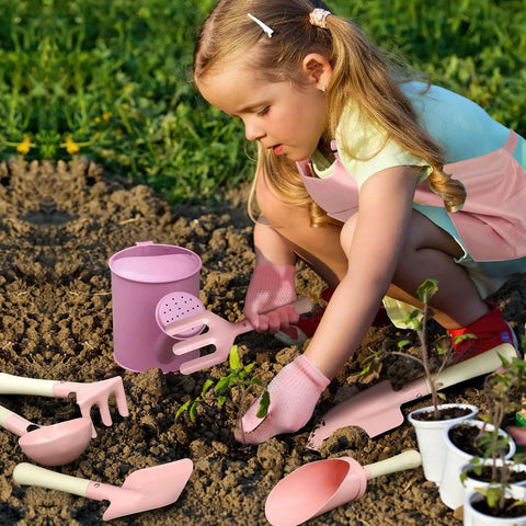 Child using Kids Garden Gear 14-Piece Tool Kit With Tote Bag Watering Can Apron Rake Shovel Trowel Gloves Garden Book STEM