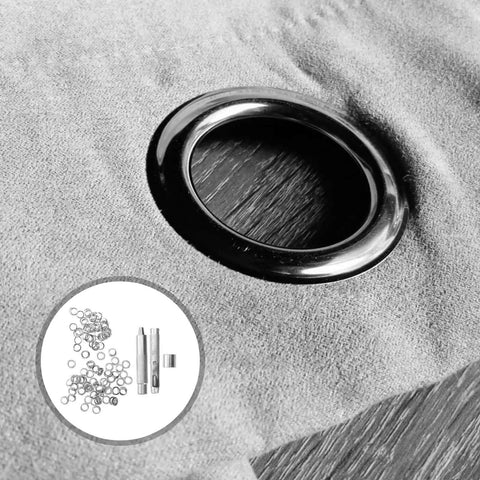 Close-up of 10mm Steel Eyelet Punch Tool And Base Kit With 100 Silver Eyelets installed on fabric
