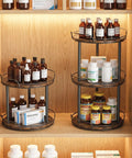 Dual Deck Lazy Susan Rotating Turntable Cabinet Organizer For Kitchen Spice Rack And Bulk Condiment Storage Rolls Super Smooth Ball Bearing Spin storing bottles on wooden shelves.