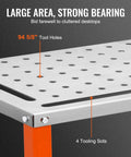 Close-up of Tough As Nails Steel Welding Table 36 By 18 Inch showing tool holes and four tooling slots for welding tasks.