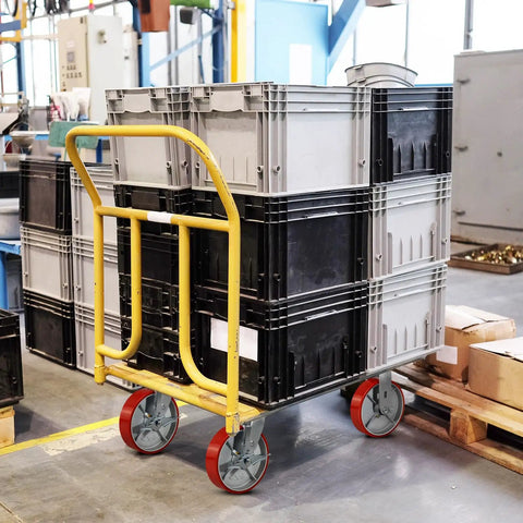 Heavy Duty Eight By Two Inch Industrial Casters Polyurethane And Steel Wheels Six Thousand Pound Capacity Built Tough For Shop Carts And Utility Dollies Rolls Easy No Sweat Swivel Lock Brakes Pack Of Four on a cart with stacked crates.
