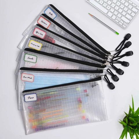 Six Pack Plastic Zipper Pencil Pouches Set Waterproof And Tear Resistant Document Folders A6 Size Zipper Pouches With 24 Blank Notes Handy Document Organizer Bags For School Office Home And Travel Storage laid on desk.