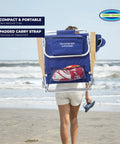 Back view of person carrying Lay Flat Five Position Backpack Beach Chair With Easy Adjustments in navy at beach