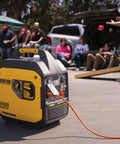 Lightweight 4000 Watt RV Ready Portable Inverter Generator With Quiet Tech for camping shown at tailgating event