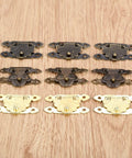 Antique Brass Gold Wood Hasp Lock Set 10Pcs Decorative Latch for Jewelry Boxes and Furniture, retro style on wooden background.