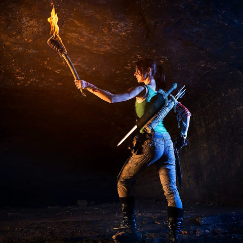 Explorer in cave holding torch with Two Piece Black Katana Sword Bag Kit With Back Strap And Waistband on back