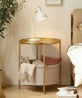 Round End Table With Removable Fabric Storage Basket And Tray Top, Gold Metal Nightstand beside bed with books and lamp