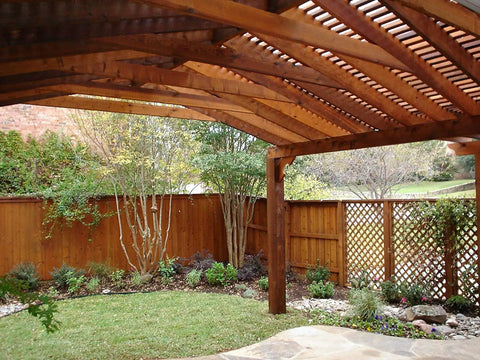 Beautiful wooden pergola and fence treated with All In One Exterior Wood Stain And Sealer For Outdoor Decks And Fences No Back Brushing Needed No Fuss Easy To Apply Waterproof Sealant With UV Protection Rich Pecan Finish In 1 Gallon No Priming Required