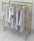 Heavy Duty Clothes Rack With Elegant Gold Finish And Dual Rail Design, 100 By 130 Cm, with clothes hanging, in room.