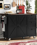 54 Inch Farmhouse Kitchen Cart Featuring A Nifty Power Outlet And Hefty Storage Space With Smooth Rolling Lockable Wheels And Sleek Black Finish.