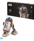 R2 D2 3D Wooden Puzzle Kit For Adults With Moving Parts And LED Projection Light next to packaging box.