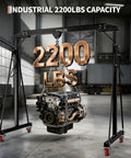 Adjustable Gantry Crane 1 Ton 2200 Lbs Portable Garage Hoist lifting an engine in a warehouse with rolling casters.