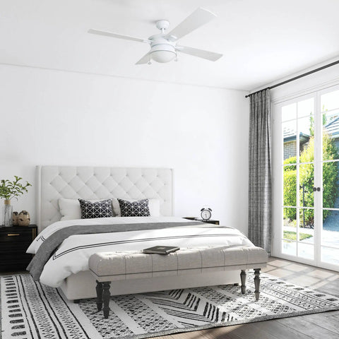 Auletta 52 Inch Outdoor And Indoor Ceiling Fan With Light Pull Chain Dual Mounting Options Slick Dual Finish Blades Reversible Motor White Finish Integrated Light Kit Damp Rated For Outdoor Use Whisper Quiet in a bright bedroom.
