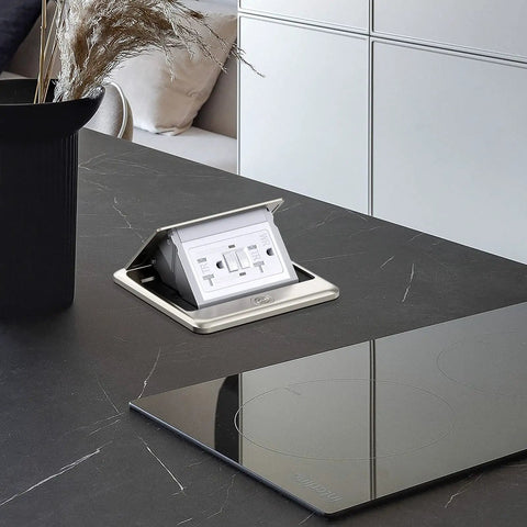 Pop Up Floor Electrical Outlet With 20 Amp GFCI, Stainless Steel Hidden Countertop Box open on black kitchen countertop