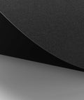 Close-up of Premium Leather Desk Pad Mat Non Slip Blotter Desk Protector, black texture, corner view