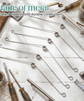 Vicenpal Recessed Lighting Spring Clips Bulk Metal Torsion Spring Clip in stainless steel laying on workbench with tools.