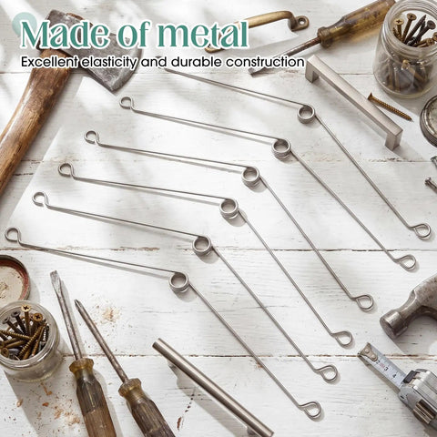 Vicenpal Recessed Lighting Spring Clips Bulk Metal Torsion Spring Clip in stainless steel laying on workbench with tools.