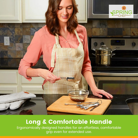 Woman using Stainless Steel Measuring Cups And Spoons Set Of 14 With Leveler, Nesting Kitchen Gear on wooden board.