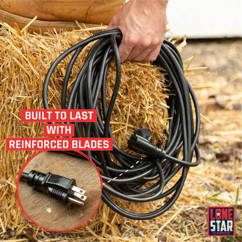 Hand holding Heavy Duty 100 Ft Indoor Outdoor Extension Cord 16 AWG 3 Prong SJTW Weatherproof Cable on hay bale