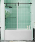 Frameless Bathtub Sliding Shower Door With Barn-Style Exposed Roller System, 56-60 Inch Width And 60 Inch Height, 8mm Clear Tempered Safety Glass, Stainless Steel Hardware In Matte Black Finish For A Modern On-Trend Bathroom Upgrade installed in a bathroom environment