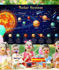 Giant Solar System Poster Banner For Space Themed Parties And Classroom Decor with happy children celebrating underneath.