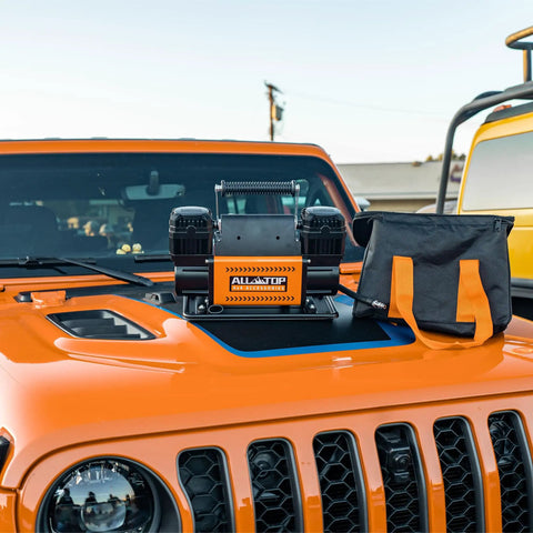 Beefy Dual Cylinder Air Compressor With Digital Pressure Gauge Tire Inflator Kit on orange vehicle hood