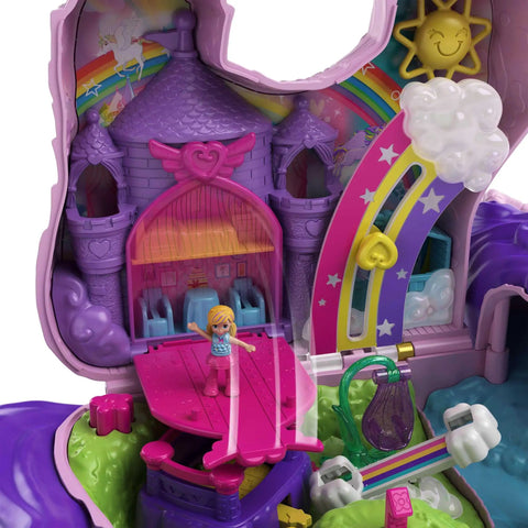 Unicorn Party Playset With 25 Surprises showing purple castle with rainbow and sun details, part of portable mini set for castle adventure.