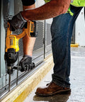 Professional Heavy Duty Cordless Rotary Hammer Drill With D Handle And One Inch Chuck being used on a concrete surface.