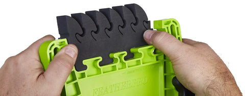 Knockout Replacement Eva Foam Feathers For Featherboards 2 Pack Heavy Duty, hands holding EVA foam pads with green base.